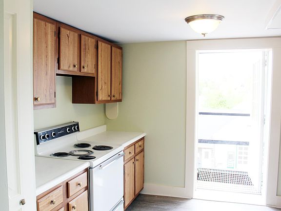 The kitchen opens to the fire escape