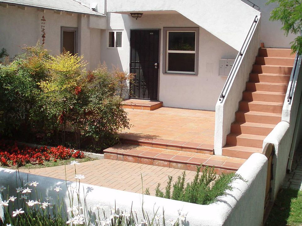 Shared front yard. Available unit is the upstairs one.