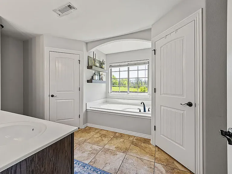 Master Bath with Large Tub, Duel Sinks and Walk-In Closets