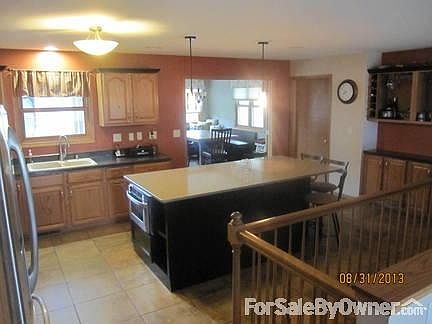 Kitchen
						:
						Kitchen island; quartz countertop & eating stools.