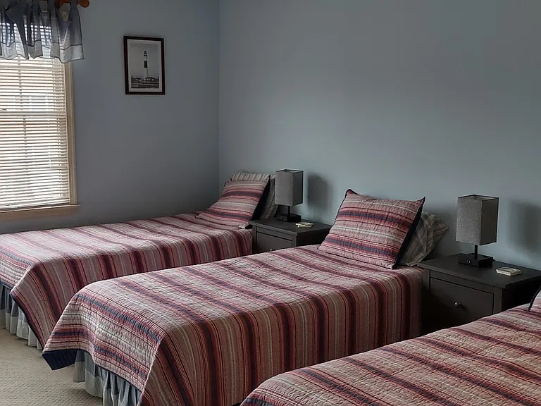 bedroom 2 with three twin beds
