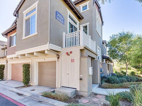 view of garage and balcony
