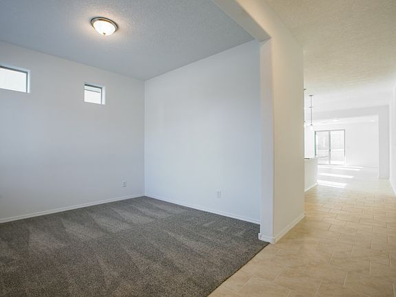Directly off the entrance you ll find a spacious den perfect for at at home office.