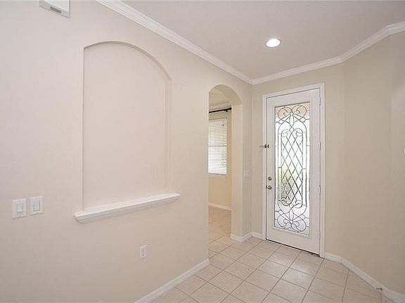 Freshly painted, crown molding, new carpet, easy care tile flooring in main areas and move-in ready!