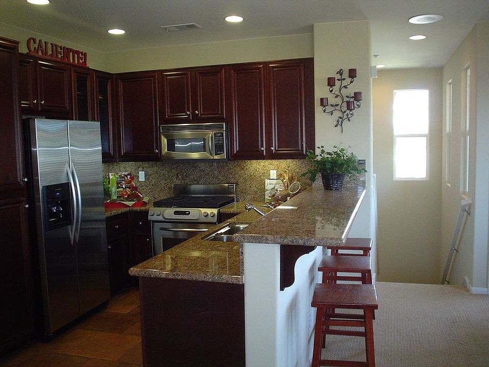 Same floorplan but photo is the model home so upgrades are different.