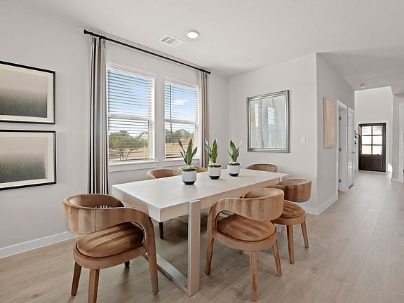 Dining in the Willow home plan by Trophy Signature Homes - REPRESENTATIVE PHOTO