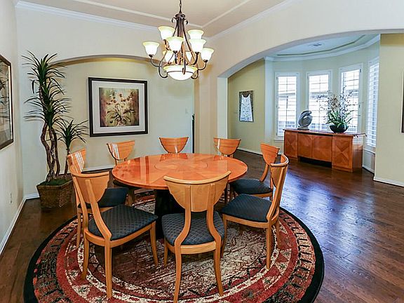 Formal Dining Room and Entry Feature Coffered Ceiling