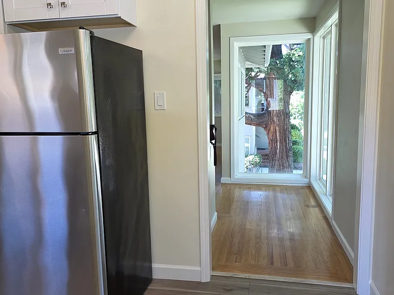 View from dining area to the floor to ceiling windows in the living room