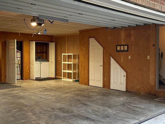 Some of the closets in the garage and the interior entrance to the apartment