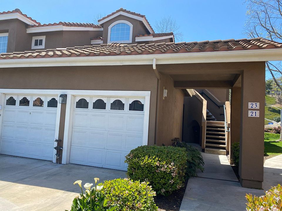 End unit, lower level. One car enclosed garage and One assigned parking space.