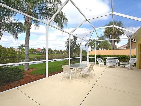 Soak up the sun on the spacious screened lanai with lake views.