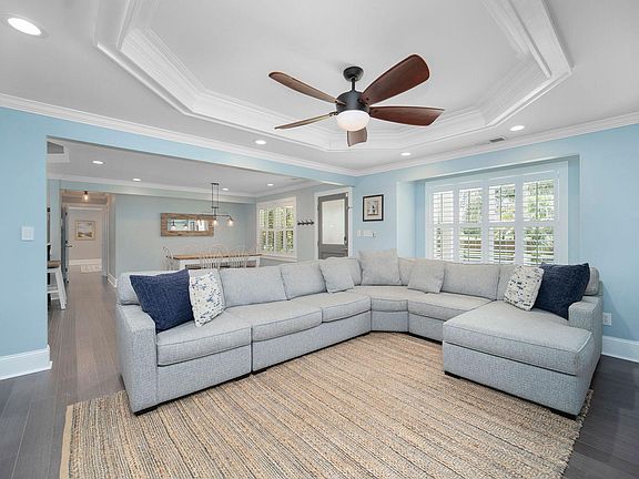 Open living area with sectional sofa and Smart TV