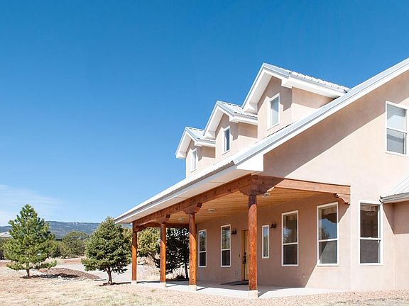 Front of Home with Sandia Mtns in bckgd