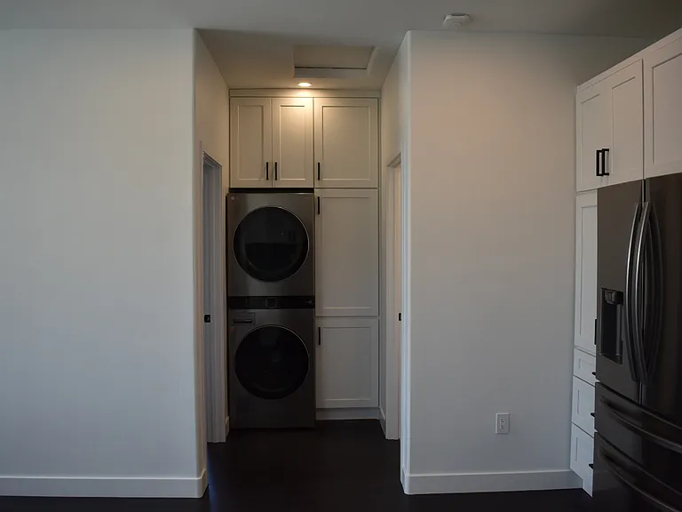 Full size washer and dryer with tons of storage space.