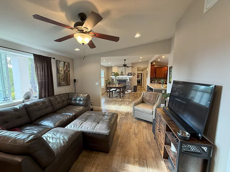 Living room, dining and kitchen in background