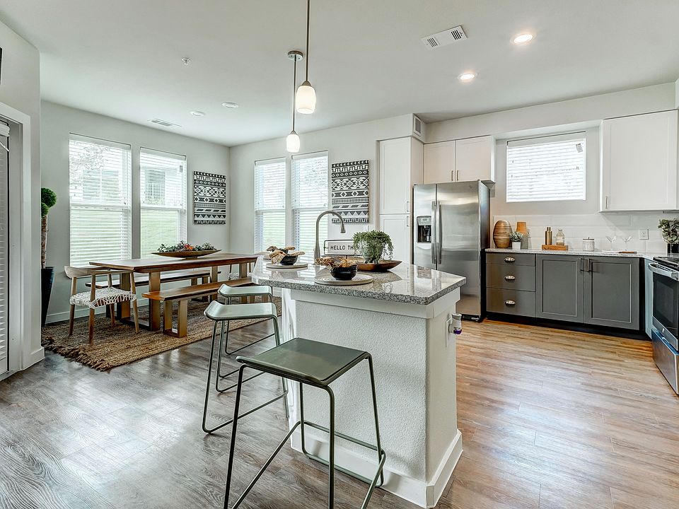 Spacious kitchen and dining room with natural lighting