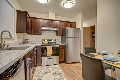Kitchen with stainless steel appliances, ample counter space and lots of cabinet storage - Foster Greens