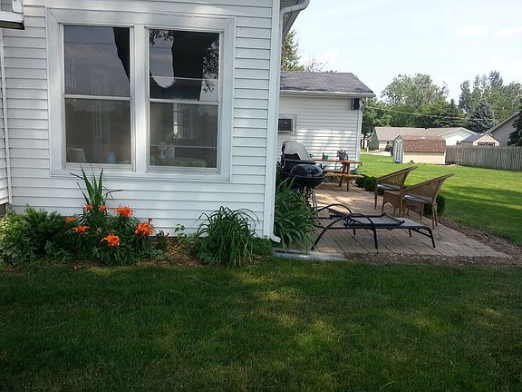 The back porch and patio with landscaping