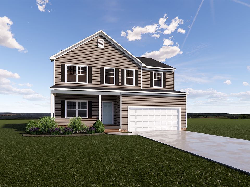 A charming two-story house with gray siding and white trim sits on a green lawn in Poplar Village, u