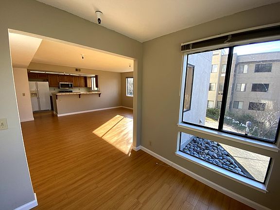 View of Living Room and Kitchen from Dining Nook