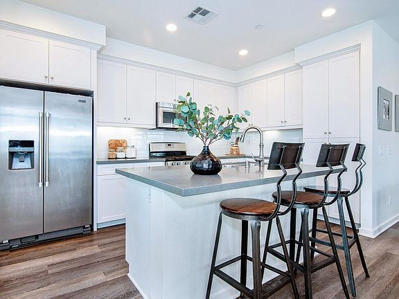 A chef's dream! Updated kitchen with lots of storage, stainless steel appliances, and a large island