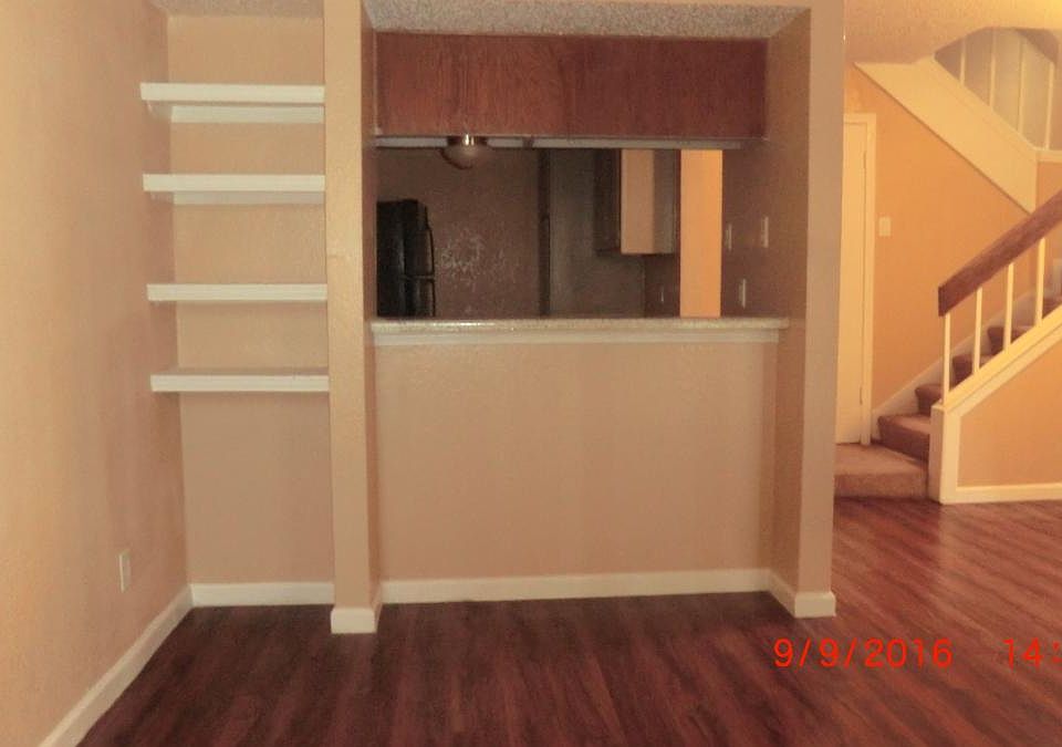 Spacious living room area with new paint and flooring