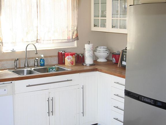 Butcher block countertop and cabinets.