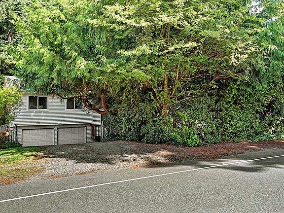 Tucked Behind Privacy Hedge 