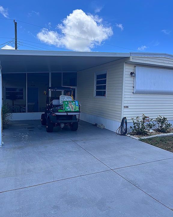 Front of home with carport