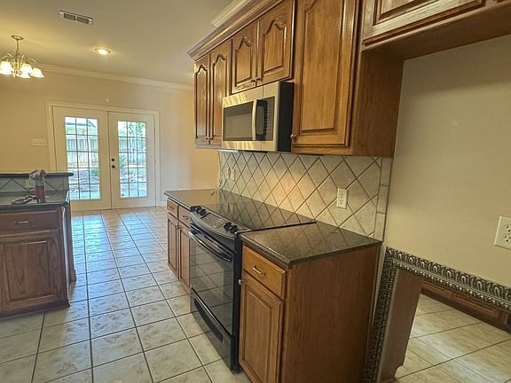 Kitchen range and microwave.