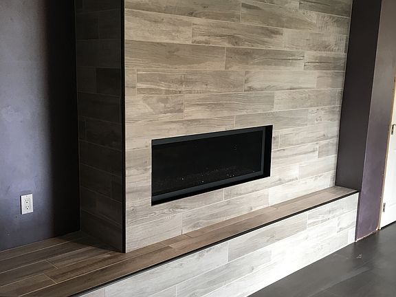 Lower level natural gas fireplace