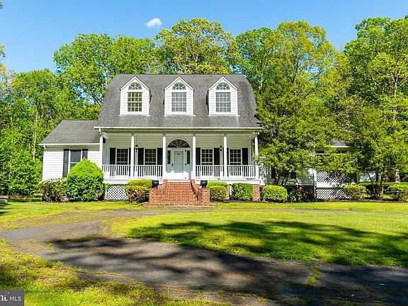 Front porch & dormer windows enhance the elevation