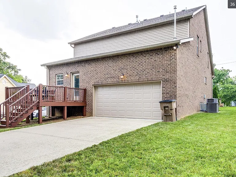 Situated on a corner lot with deck, private driveway and 2-car attached garage.