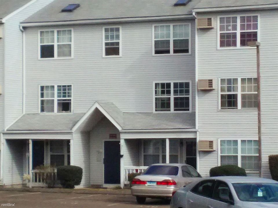 Exterior of building, private and visitor parking.