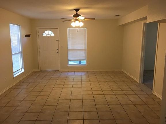 Great room-looking straight ahead at front door. Bedrooms to the right, kitchen and washer/dryer closet behind.