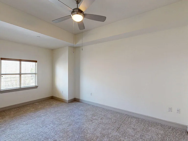 Spacious apartment Bedroom with Carpet Floor.