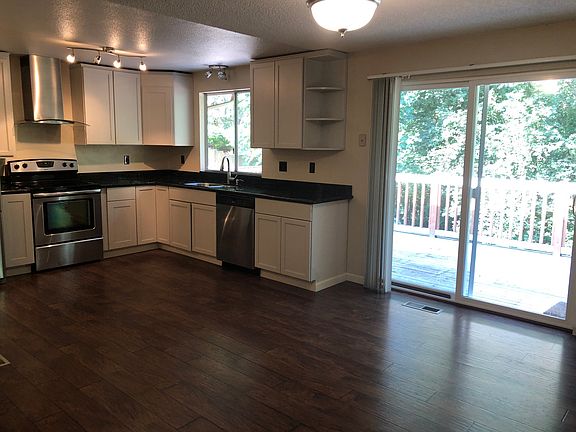 Kitchen with Back Door Slider Leading to Deck
