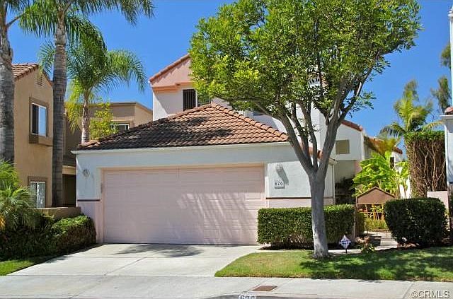 2 car attached garage with access to kitchen. Two spaces on dri