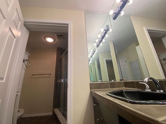 Vanity Sink with Bright Lighting in Master Bedroom