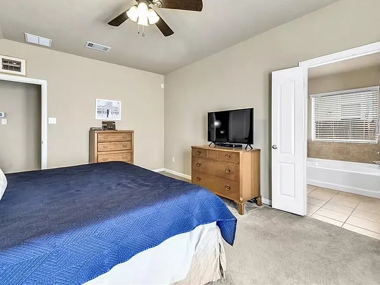 primary bedroom into primary bath
