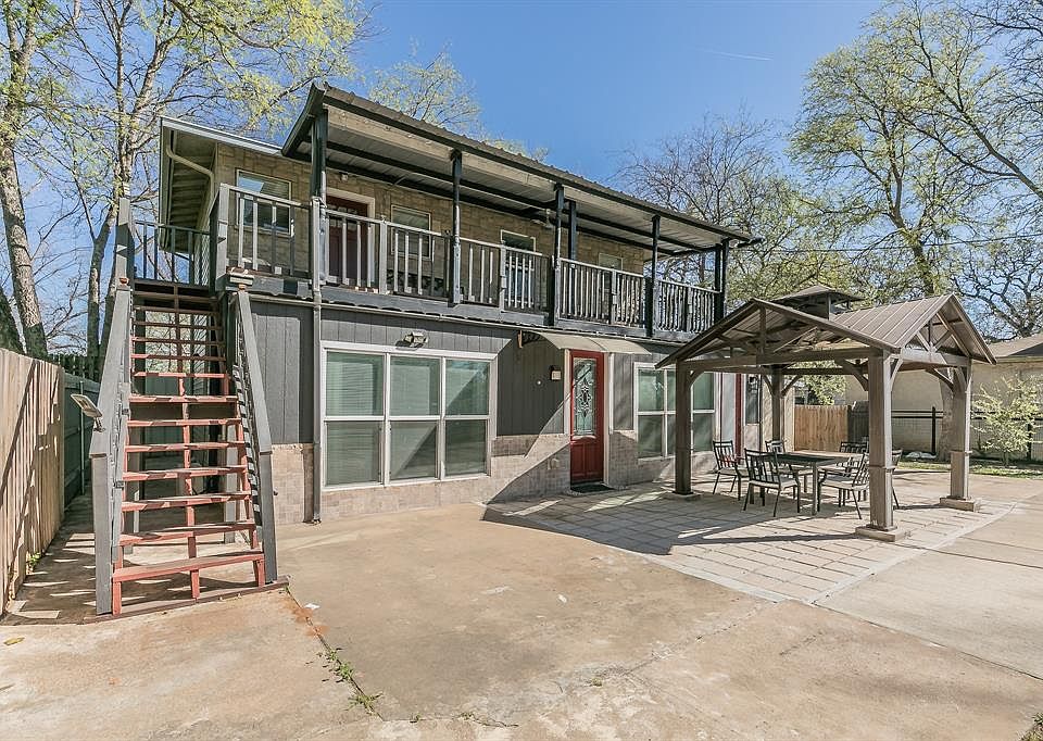 Back of house with a patio, fence, a gazebo, and stairs