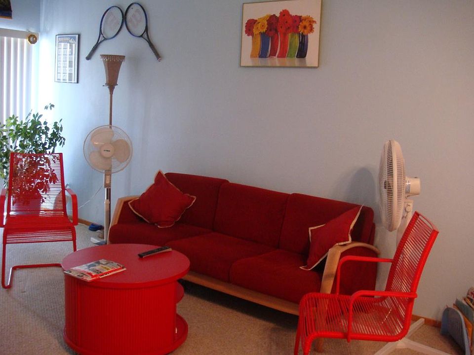 Living Room. Some of the furniture in the pictures may not be available in the home when made available for rent.
