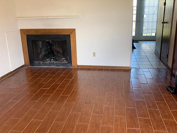 Living room with wood burning fireplace