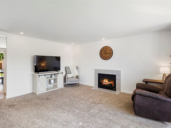 Generous sized living room with gas fireplace. 