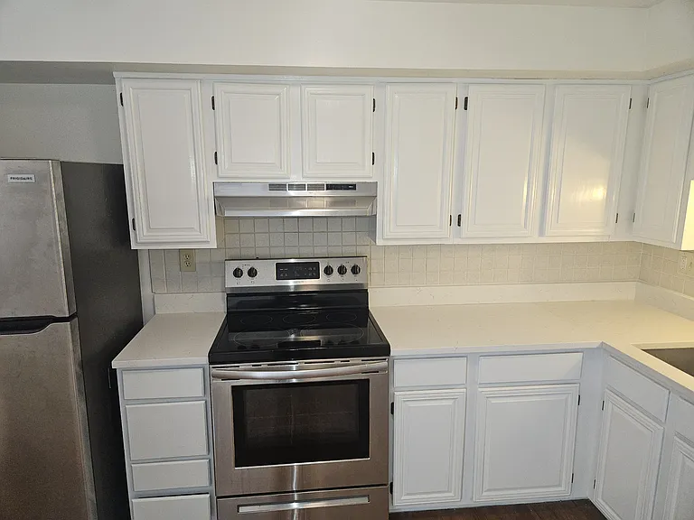 Kitchen has open space concept, including new Frigidaire refrigerator (2024), Frigidaire range (2020), Samsung dishwasher (2018), and recent updates including new kitchen sink & counter (2025).