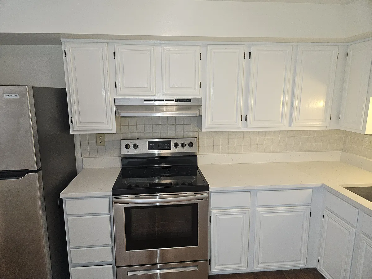 Kitchen has open space concept, including new Frigidaire refrigerator (2024), Frigidaire range (2020), Samsung dishwasher (2018), and recent updates including new kitchen sink & counter (2025). - 7724 Havenside Ter