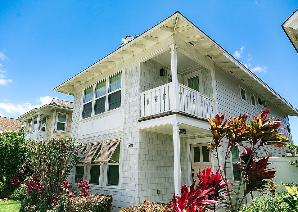 House w/ freshly pruned tree