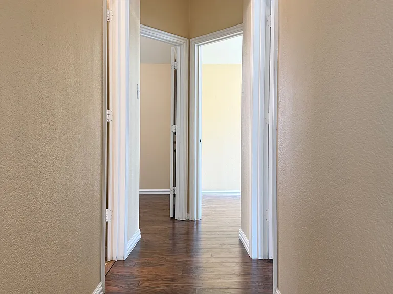 Hall to the three bedrooms