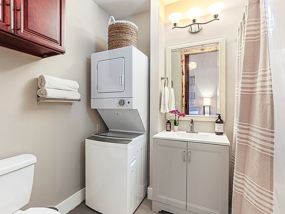 Stackable washer & dryer in the bathroom