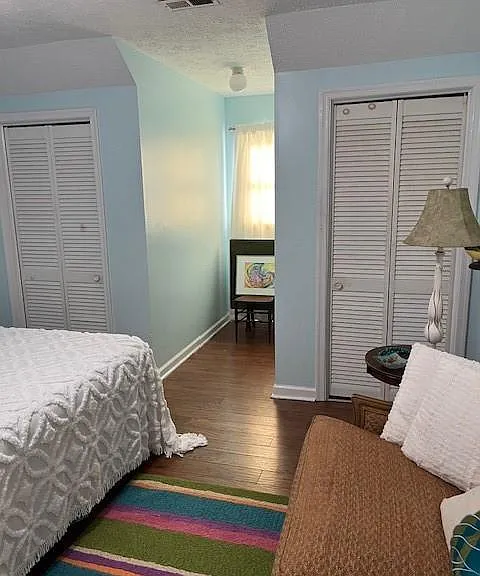 Furnished bedroom showing two closets